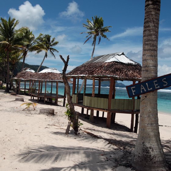 Fales on a sandy beach in American Samoa.