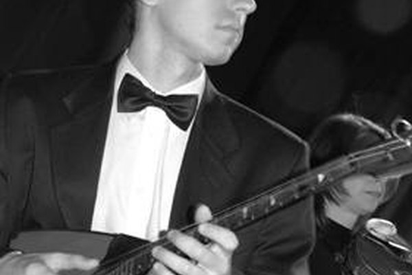Dmitry Kalinin tocando la balalaika Prima.