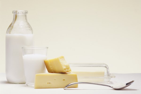 Milk Bottle, Glass of Milk, Cheese, Butter and a Spoon