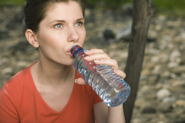 Woman drinking bottled water