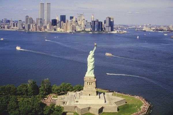 Statue of liberty across Manhattan skyline