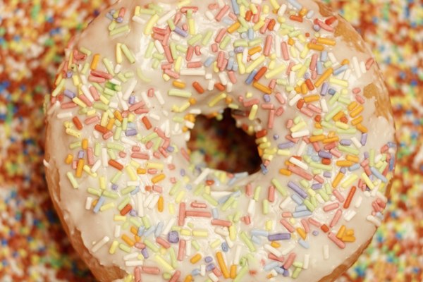 Close-up of ring doughnut with icing and sprinkles