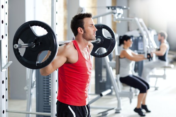 man with dumbbell weight training equipment  gym