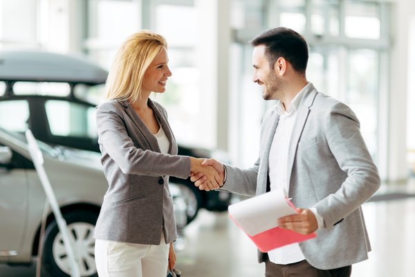 Customer buying a car at dealership
