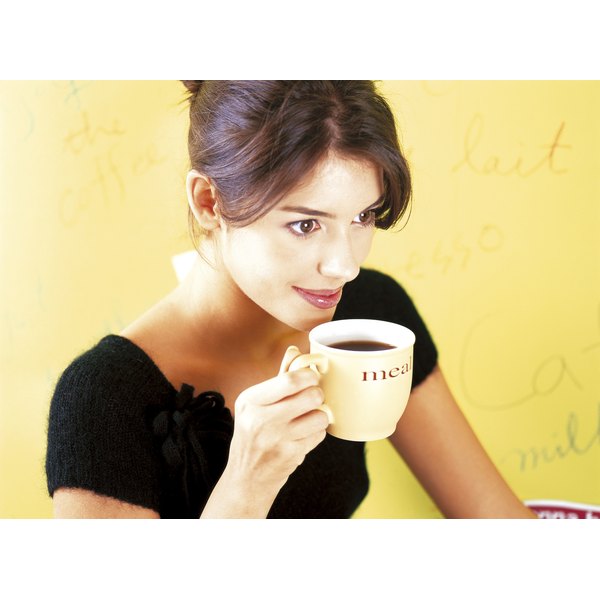 Young woman drinking coffee.