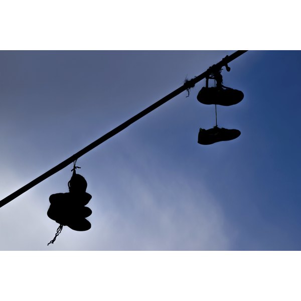 what-do-shoes-on-power-lines-mean-synonym