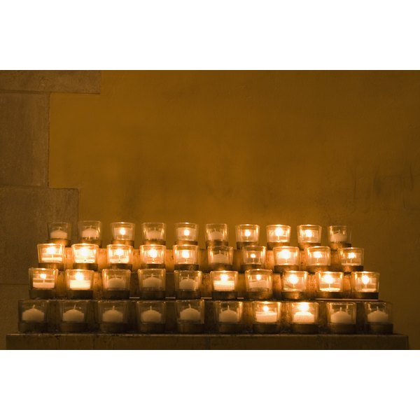 Why do catholics light candles in church synonym