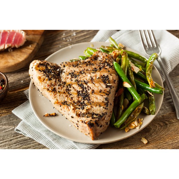 How To Cook Tuna Steaks : How to Cook a Frozen Ahi Tuna Steak in Minutes ... / Fresh tuna is typically considered done when it begins to flake on the outside but remains pink in the center.