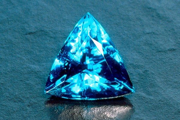 Paraiba tourmalines are a clear, ocean blue but will also emit green 