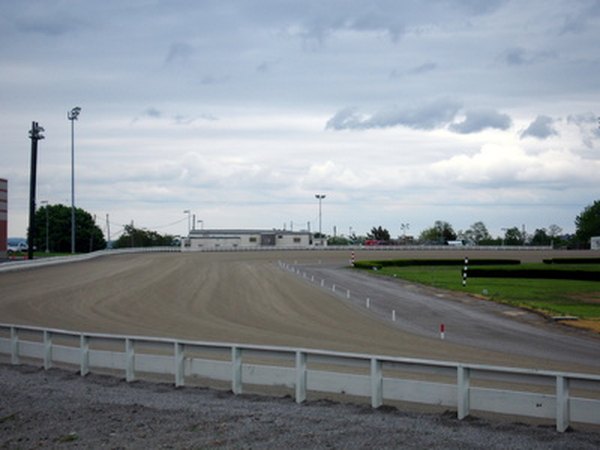 The inward slant of a racetrack is an applied use of centrifugal force.