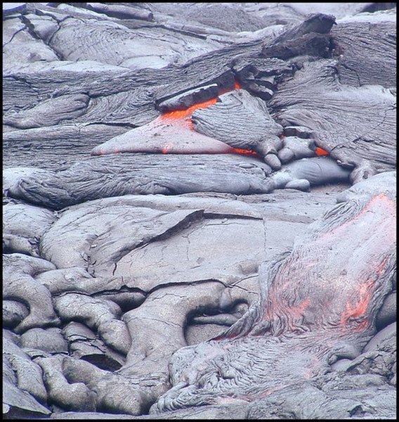 Cooled lava usually turns a black or grey color.