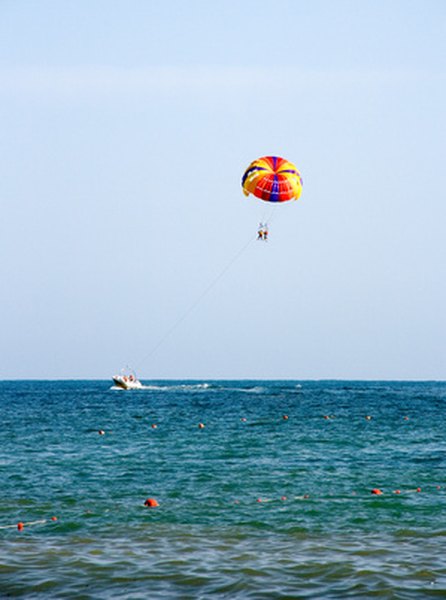 Parasailers are often seen along the coast.