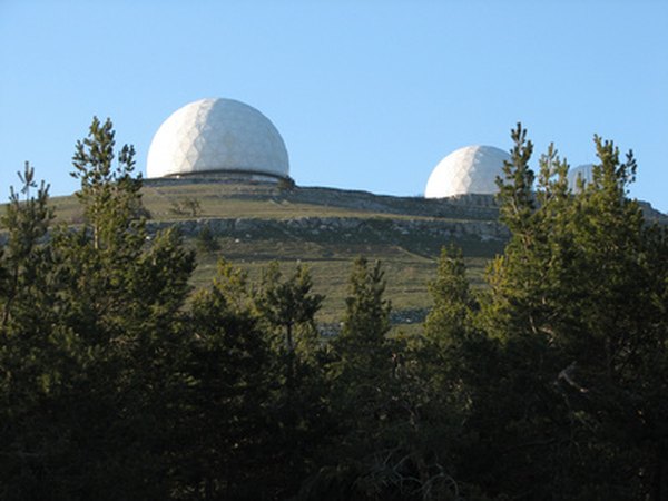 Observatories house optical telescopes for astronomical research.