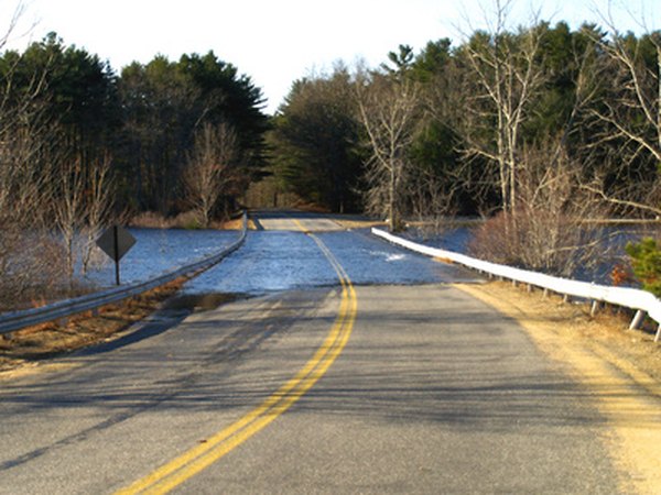 Road flooding resulting from lack of proper drainage.