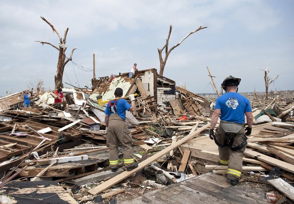 Fire firefighters conducting a search and rescue mission.