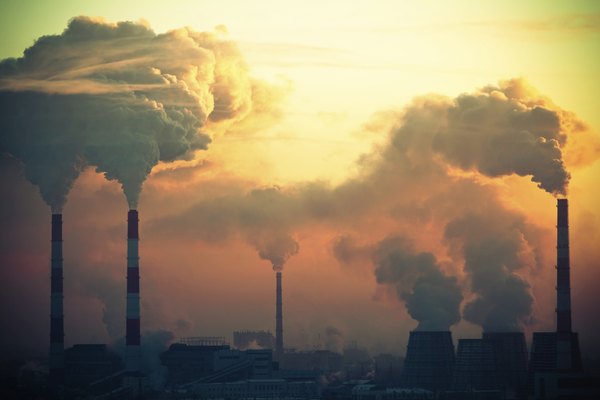 Smoke coming out of several smoke stacks.