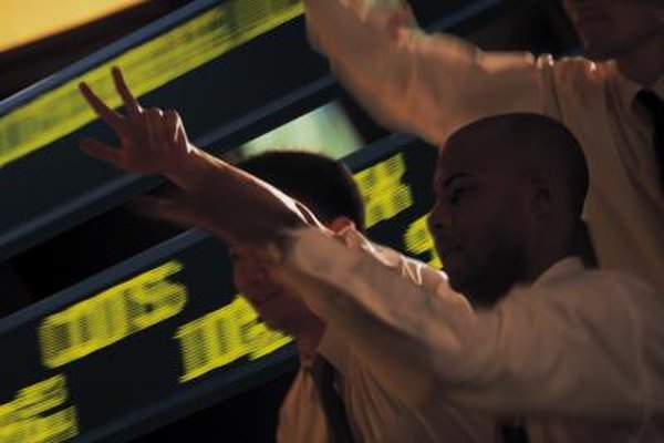 Stock traders buy and sell at a frenetic pace on the floor of stock exchanges.