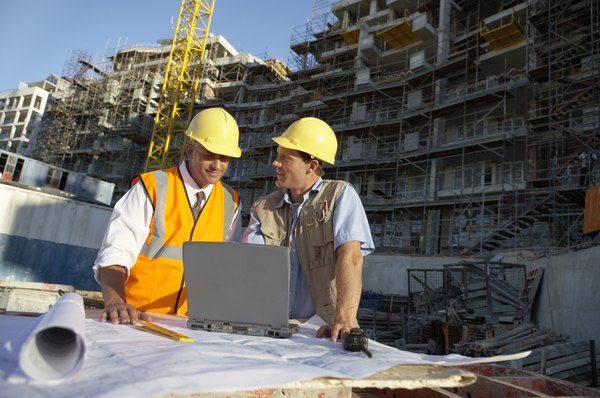 Photo Credit: Digital Vision./Digital Vision/Getty Images Construction workers in the field