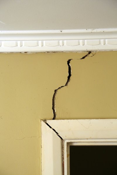 Photo Credit: MarkPiovesan/iStock/Getty Images Sinking foundations cause cracking walls.