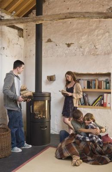 Wood-burning stoves provide an economic alternative to central-heat furnaces