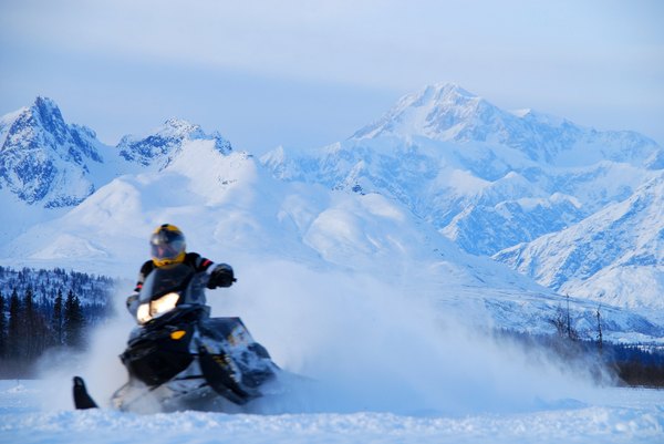 Snowmobiling is more exciting with Mount McKinley watching.