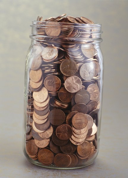 Pennies oxidize as they age, giving them a dull brown color.