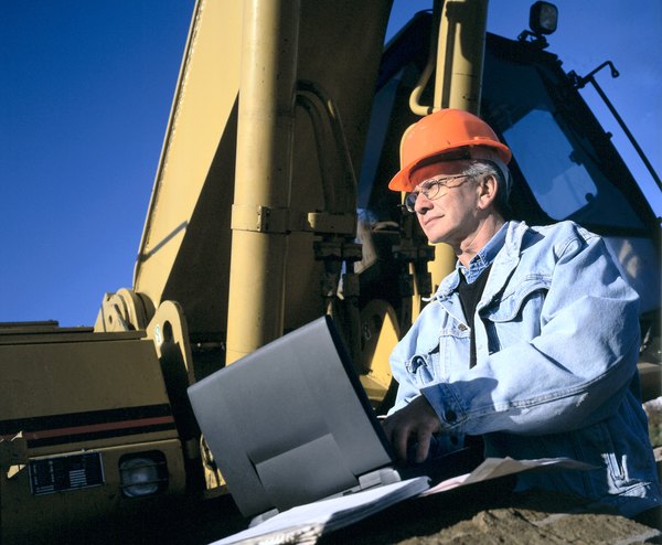 Photo Credit: Hemera Technologies/Photos.com/Getty Images Engineer on a computer