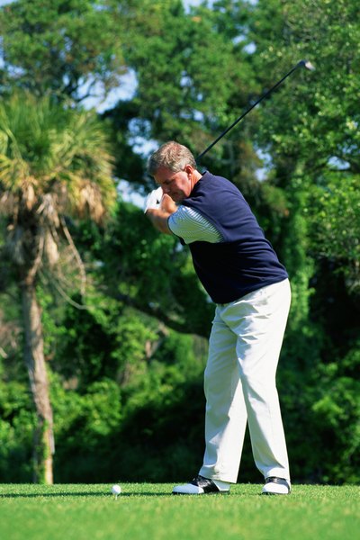 The left shoulder should be under the chin at the top of your backswing.