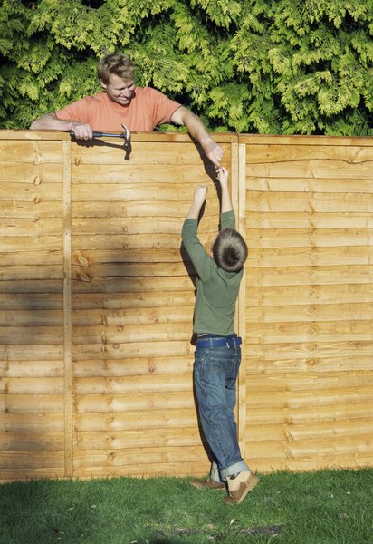 How To Attach A Wooden Privacy Fence To A Cinder Block Wall Homesteady