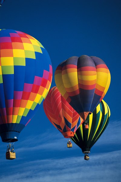 Hot air balloons float in the cooler and more dense air.