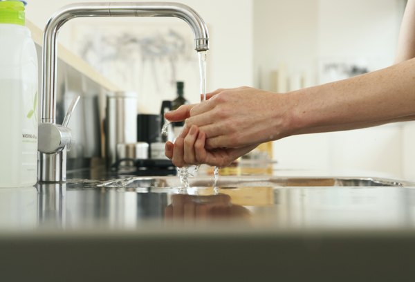How to Fill a Rinse Aid Jet-Dry Whirlpool Dishwasher | HomeSteady