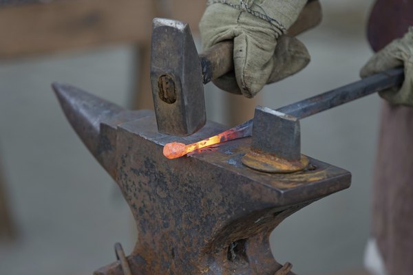 Blacksmith shaping iron