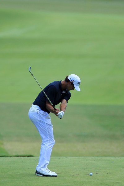 A powerful downswing is key for maximum distance.