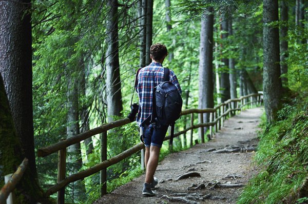 Going up in elevation causes the barometric pressure to drop.