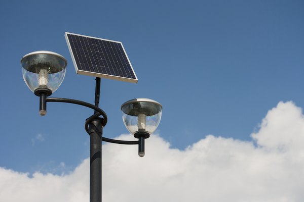 A street lamp powered by solar panels.