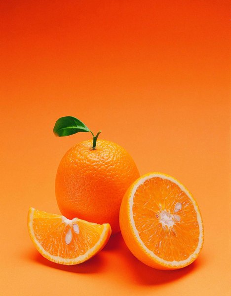 Photo Credit: Stockbyte/Stockbyte/Getty Images Illustrate simple fractions by slicing an orange into sections.