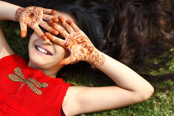 Long ago, the henna plant's stem and leaves were ground up and made into a paste as a paint for the skin.