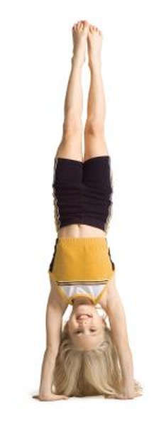 How to Go From a Handstand to a Shoulder Sit - Woman