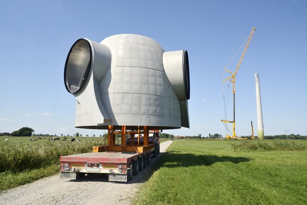 The rotor hub of a turbine being transported to a farm.