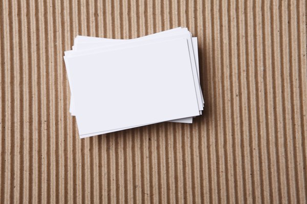 A stack of index cards laying on a table.