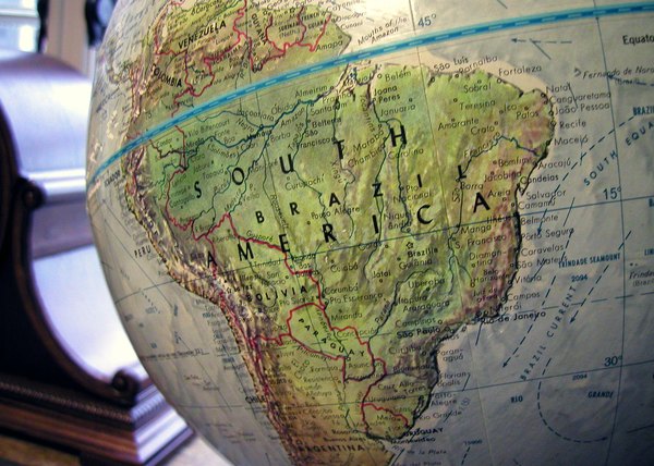 A close-up of the equator line on a globe.