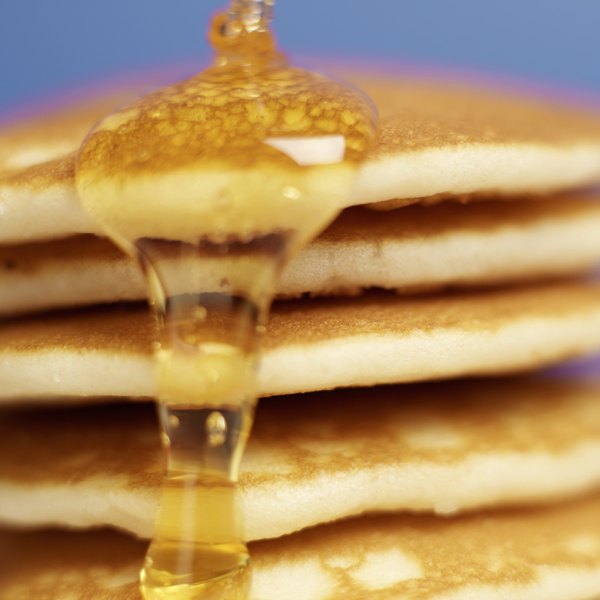 When cold syrup is heated, it becomes less viscous and easier to pour.