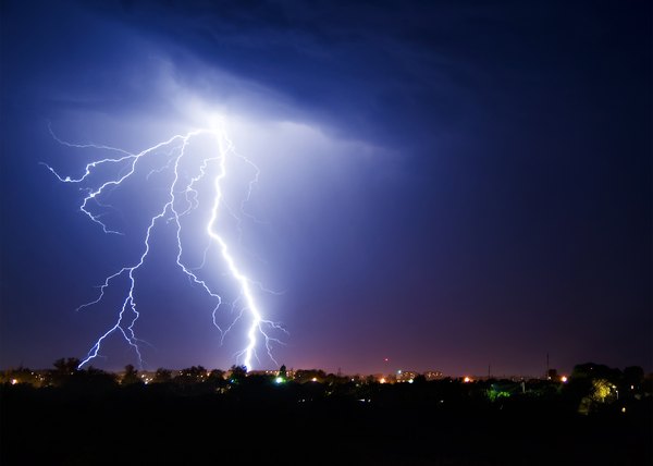 Lightning stikes over a small town.