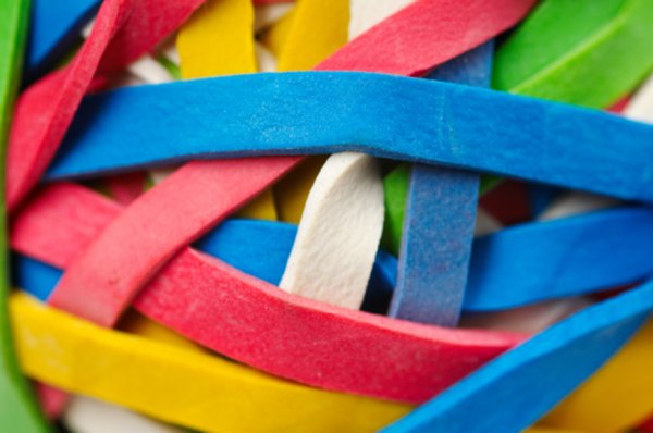 Longer rubber bands should produce lower and longer sounds.