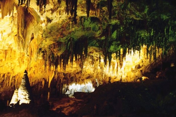 Photo Credit: Jupiterimages/Photos.com/Getty Images Formations of calcite stalagmites and stalagtites in a cave.