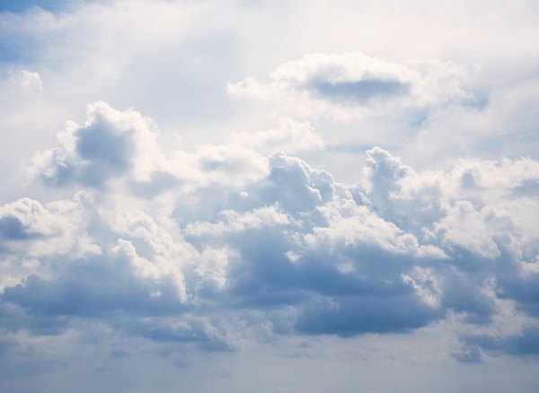 Air pushes clouds across the sky.