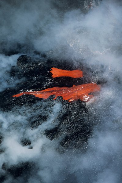 Flowing lava glows red-hot.