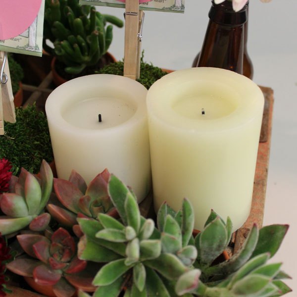 As velas deverão ficar apoiadas no caixote