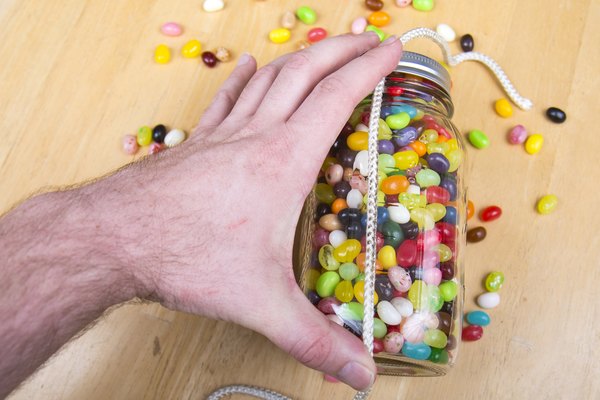 Measure the jars height in jelly beans.