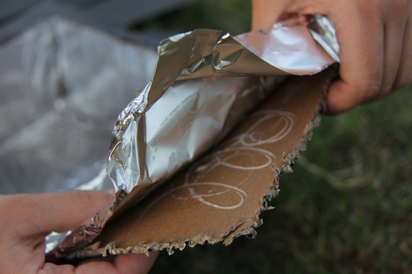 Attach foil to the interior of the box